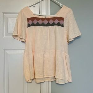 Cream with olive, mauve & rust yoke accent.  Lighteright gauzy material.